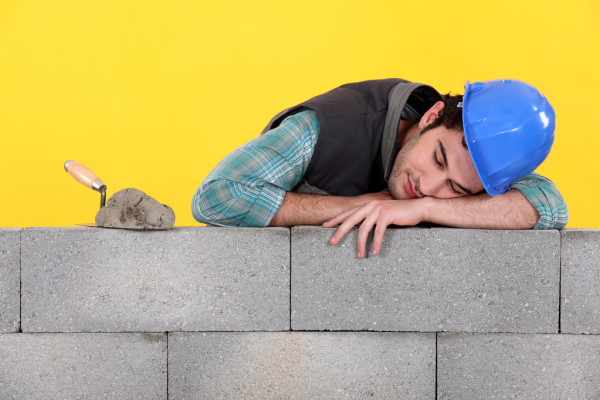 depositphotos_10497733-stock-photo-builder-asleep-on-a-wall.jpg